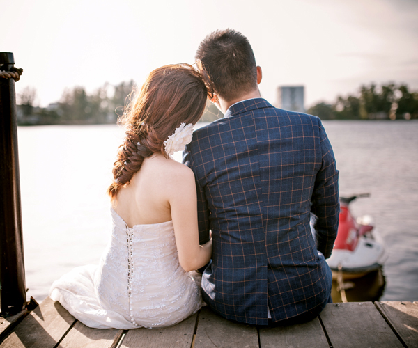 Couple Sitting On Riverside